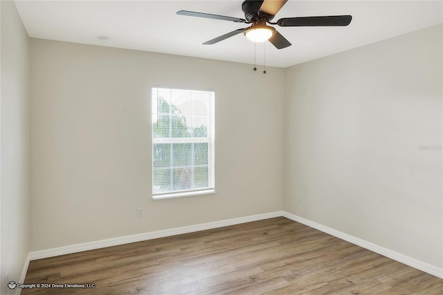 empty room featuring light hardwood / wood-style floors and ceiling fan