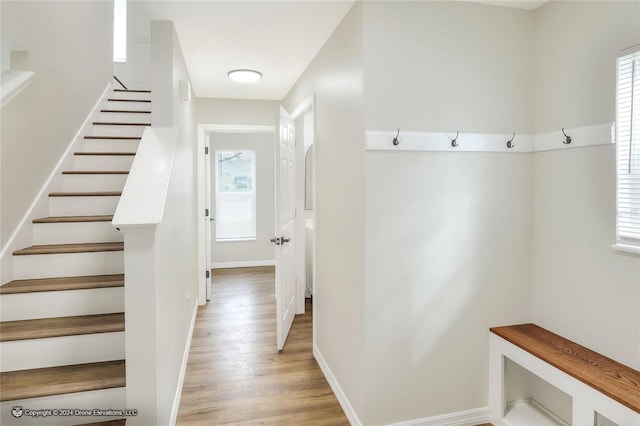 mudroom with light hardwood / wood-style floors