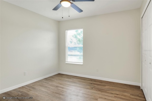 unfurnished room with light hardwood / wood-style floors and ceiling fan