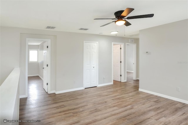 interior space with ceiling fan and light wood-type flooring