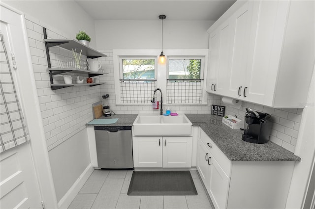 kitchen featuring sink, stainless steel dishwasher, and white cabinets