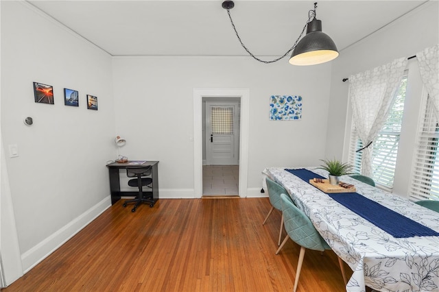 dining space with hardwood / wood-style floors