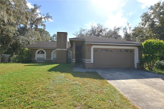 view of front of home with a front lawn and a garage