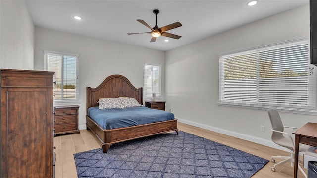 bedroom with light wood-type flooring and ceiling fan