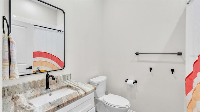 full bathroom featuring toilet and vanity