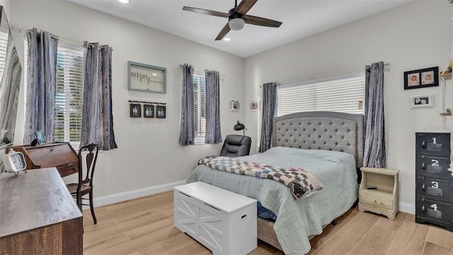 bedroom with light wood-type flooring and ceiling fan