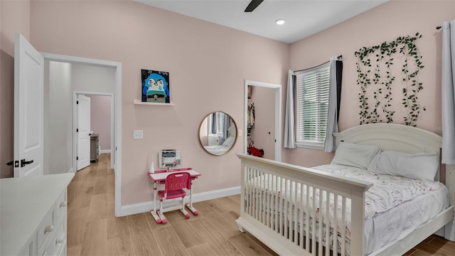 bedroom with recessed lighting, a ceiling fan, baseboards, and light wood finished floors