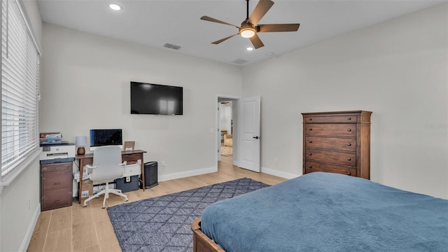 bedroom featuring light wood finished floors, visible vents, baseboards, ceiling fan, and recessed lighting