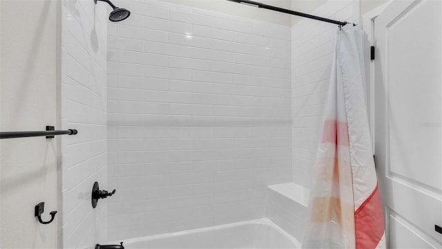 bathroom featuring shower / bathtub combination with curtain