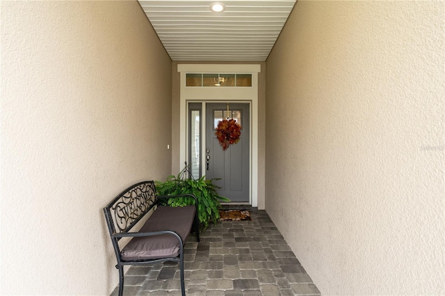 7929 Lake James Blvd, Lakeland, FL 33810 - doorway to property featuring stucco siding
