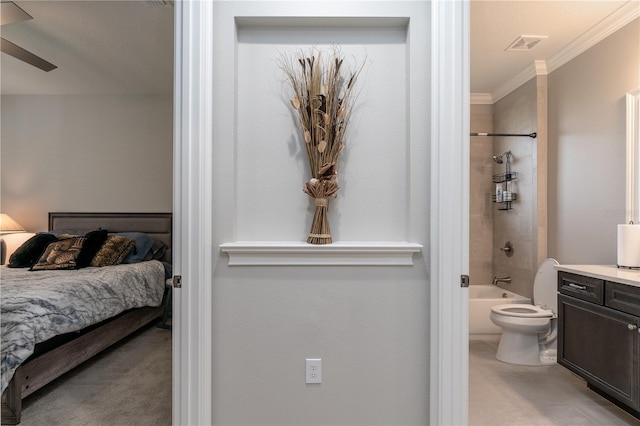 bedroom featuring connected bathroom, crown molding, and ceiling fan