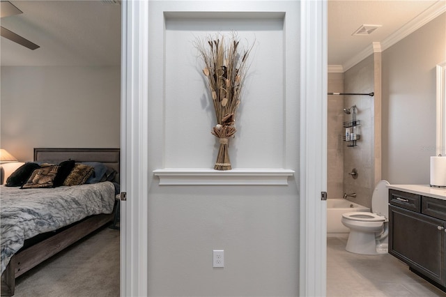 7929 Lake James Blvd, Lakeland, FL 33810 - bedroom with ornamental molding, ensuite bathroom, and light colored carpet