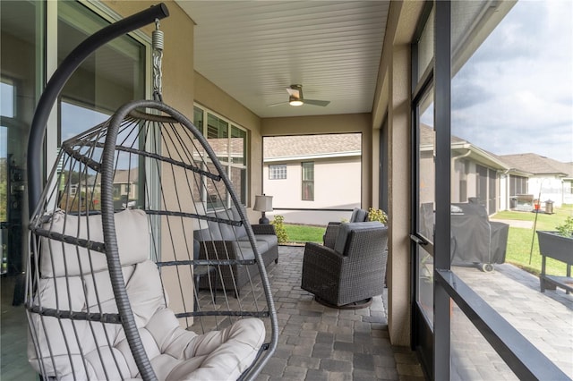 sunroom / solarium with ceiling fan