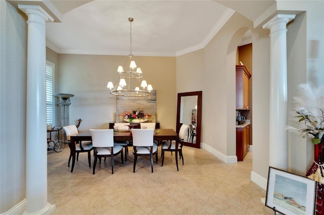 dining room with ornamental molding, decorative columns, and a notable chandelier