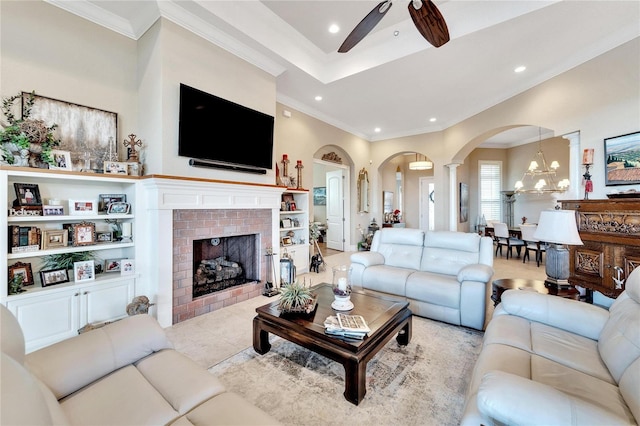 living room featuring decorative columns, ornamental molding, light tile patterned floors, and a fireplace