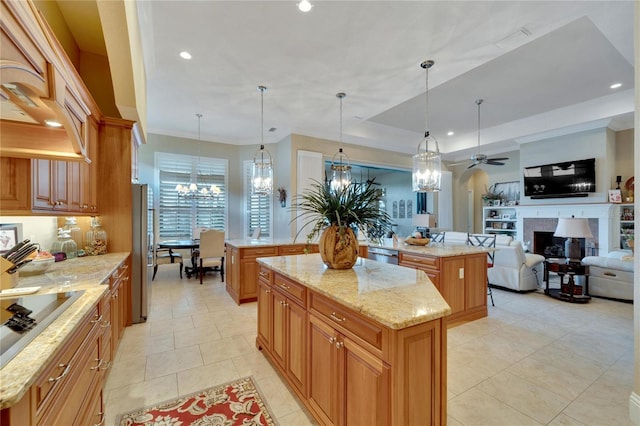 kitchen with stainless steel appliances, a center island, and hanging light fixtures