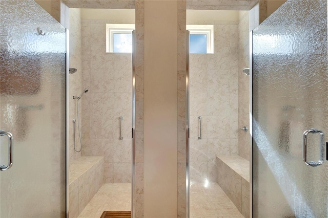 bathroom featuring a shower with door