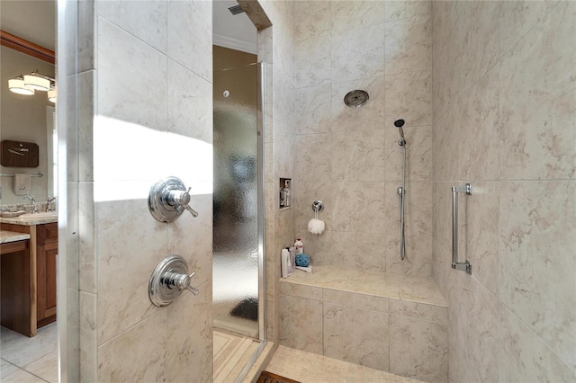 bathroom featuring vanity, crown molding, tile patterned flooring, and an enclosed shower