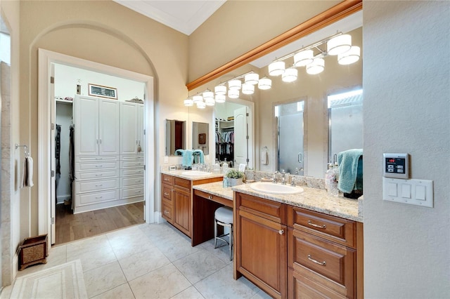 bathroom with vanity, hardwood / wood-style flooring, and ornamental molding