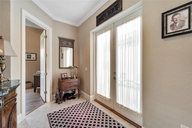 doorway with french doors, ornamental molding, and light wood-type flooring