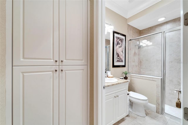 bathroom featuring a shower with door, vanity, ornamental molding, and toilet