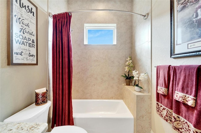 bathroom with shower / bath combination with curtain and toilet