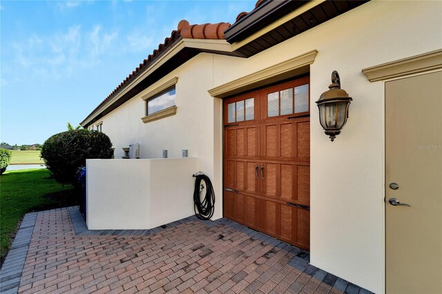 view of property exterior featuring a garage