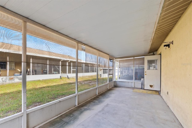 unfurnished sunroom with lofted ceiling