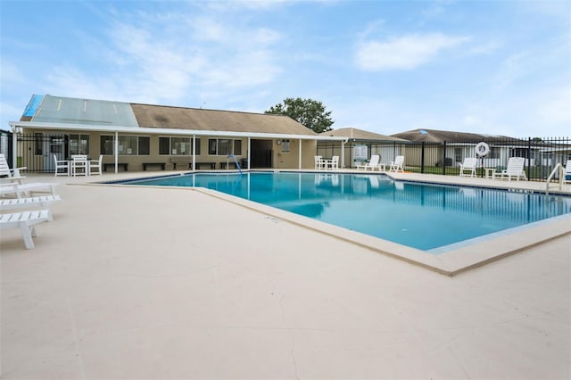 view of swimming pool featuring a patio