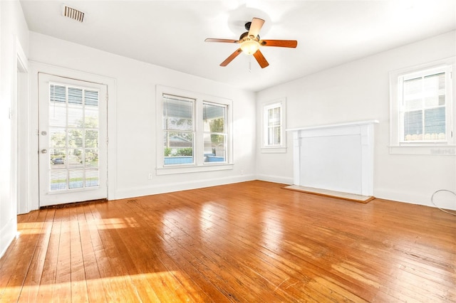 empty room with wood-type flooring and ceiling fan