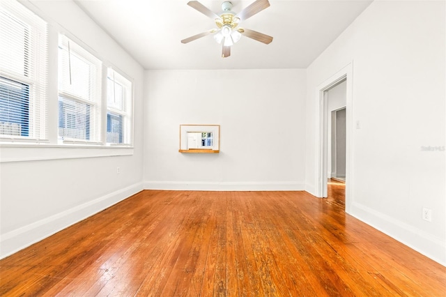 spare room featuring ceiling fan and hardwood / wood-style flooring