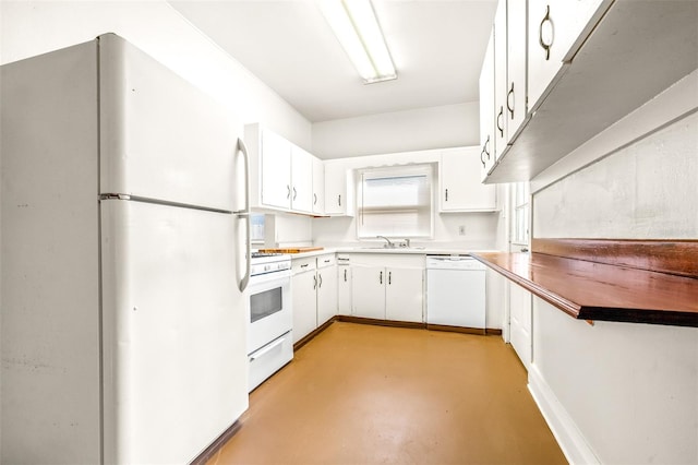 kitchen with white appliances, sink, and white cabinets