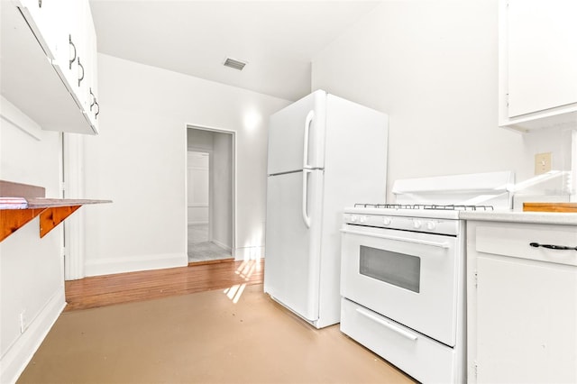 kitchen with white cabinetry and white appliances