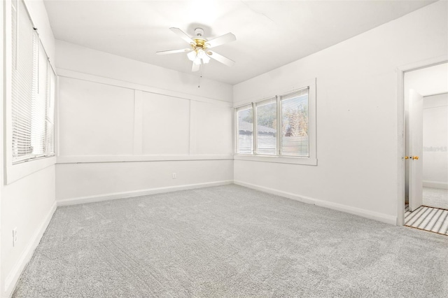 empty room with carpet and ceiling fan