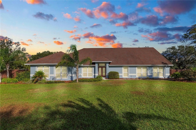 view of front of property with a yard