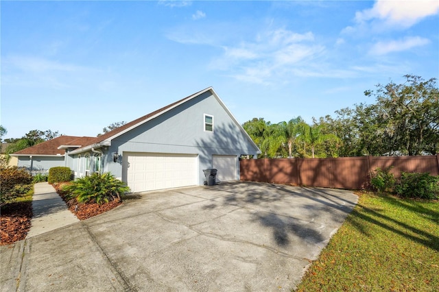 view of side of home with a garage