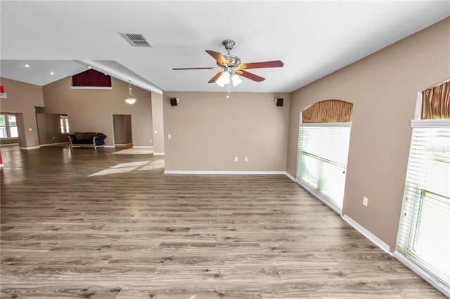 unfurnished living room with hardwood / wood-style floors, ceiling fan, and lofted ceiling