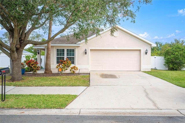 single story home with a front yard and a garage