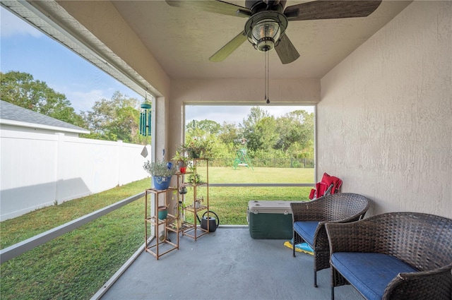 sunroom / solarium with ceiling fan