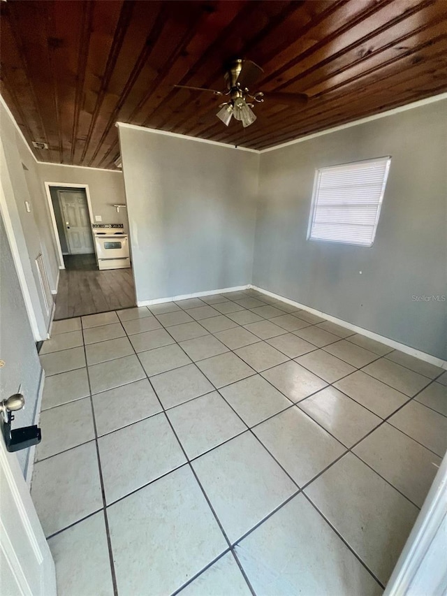 unfurnished room featuring ceiling fan, crown molding, wooden ceiling, and light tile patterned flooring