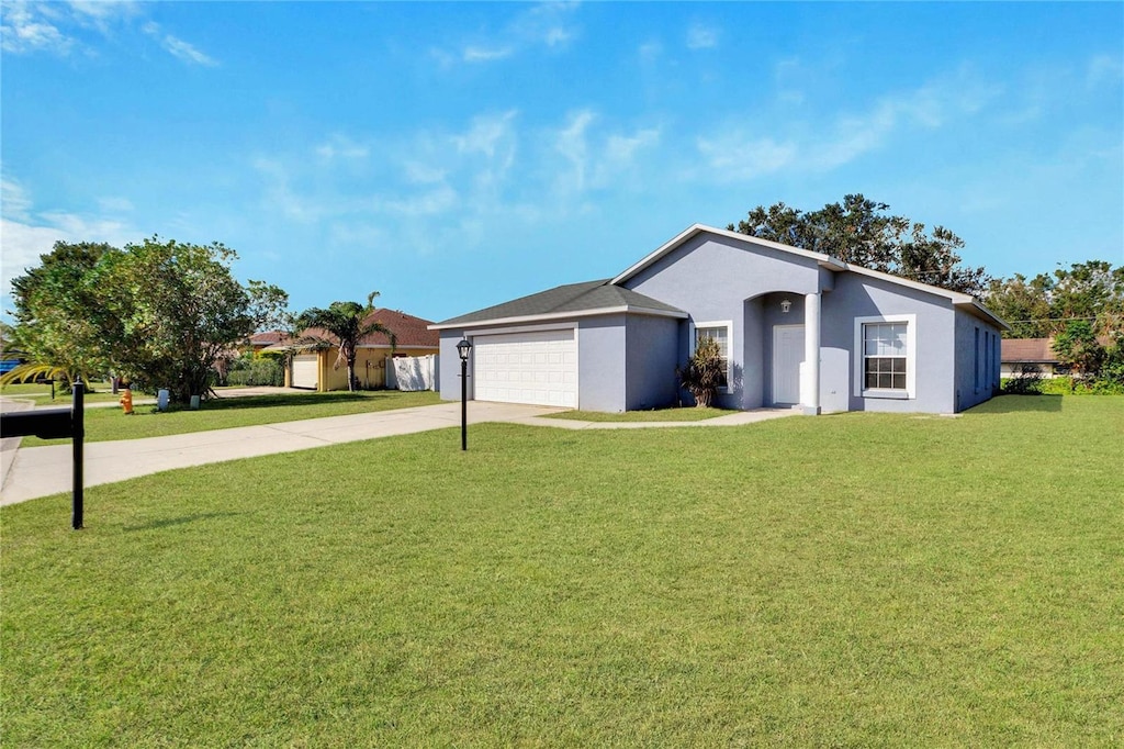 single story home with a garage and a front yard