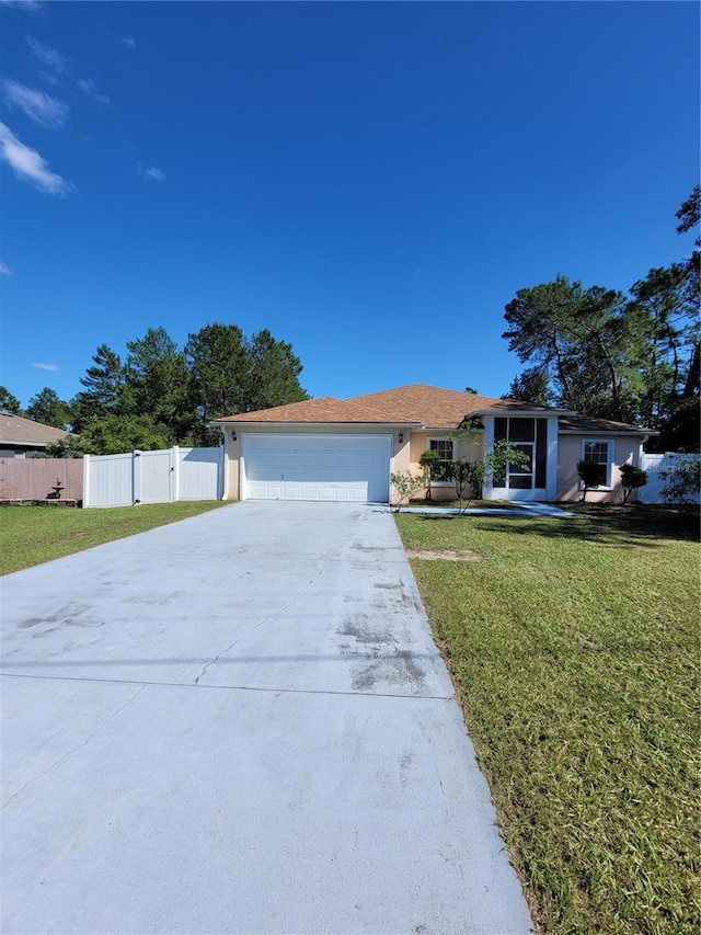 single story home with a front lawn and a garage