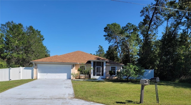 view of front of house with a front lawn and a garage