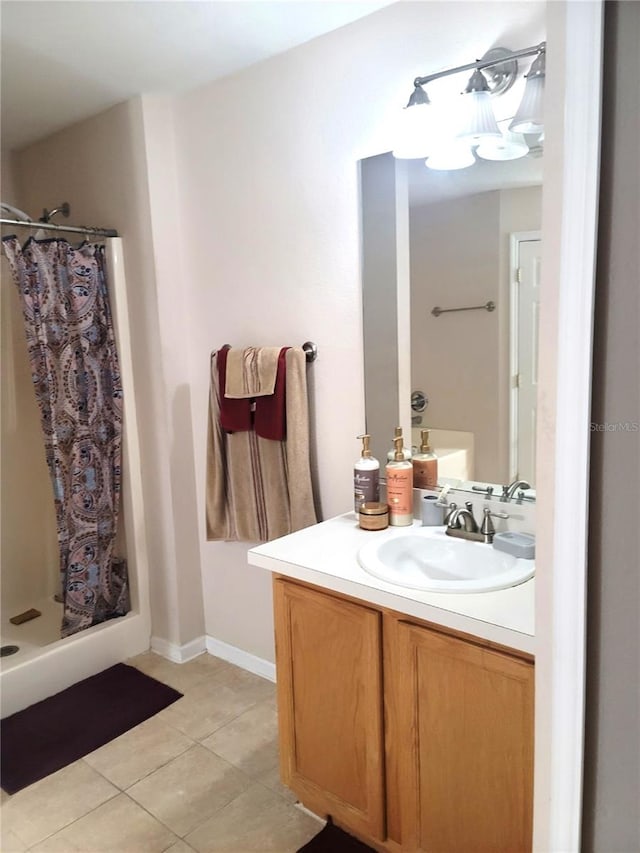 bathroom with vanity, tile patterned floors, and a shower with curtain