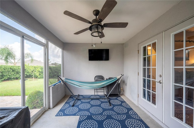 sunroom with french doors and ceiling fan