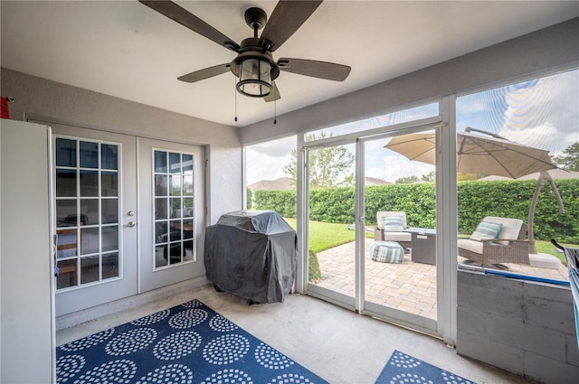 sunroom with french doors and ceiling fan