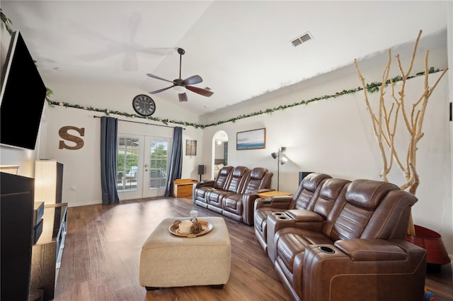 living room with ceiling fan, wood-type flooring, french doors, and vaulted ceiling