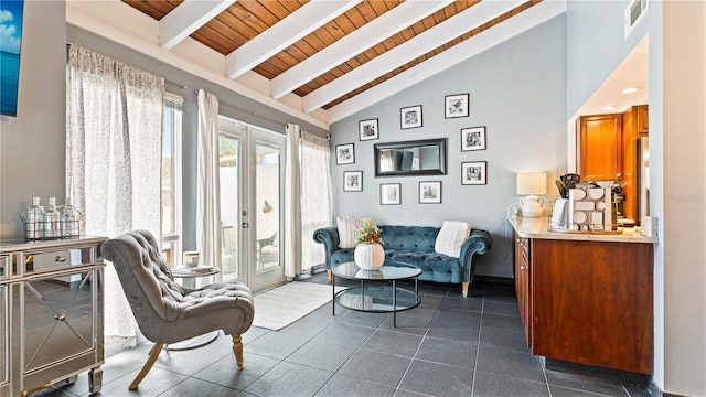 sitting room featuring high vaulted ceiling, french doors, wooden ceiling, and beam ceiling