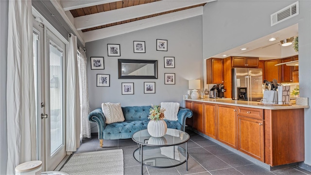 tiled living room with wooden ceiling, a wealth of natural light, and vaulted ceiling with beams