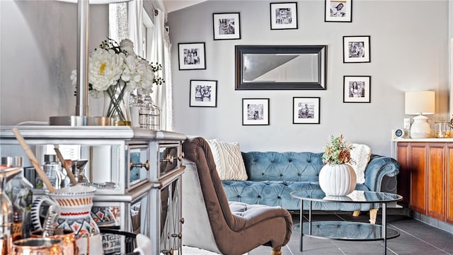 sitting room featuring dark tile patterned flooring